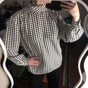 Black and white houndstooth long sleeve blouse with button neckline